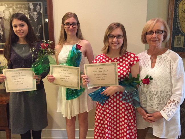 Recipients of art scholarships from the American Association of University Women at the organization's meeting Saturday included , from left, Sekora Schumann, Evan Hernandez, and Brooklyn Hoffmann, with Elinor Bossone, who chairs the arts scholarship committee. The organization handed out many additional scholarships. 