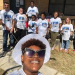 Tyona Ash in the foreground takes a selfie of the volunteers who cleaned up Martin Luther King Jr. Avenue in Bunnell today. (Tyona Ash)