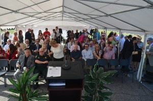 Representatives from every local government agency--with the school board's exception--many businesses and media waited for the governor's arrival under a tent. That's the eminent John Walsh, the Palm Coast Observer publisher, waving and trying to get FlaglerLive's attention to the right. (© FlaglerLive)