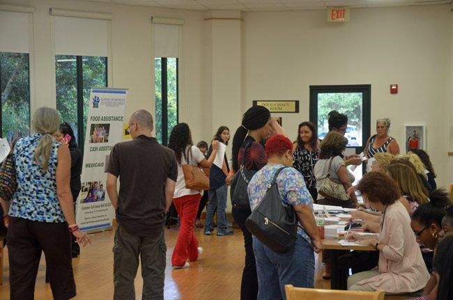 Flagler County's assistance center in the Doug Cisney Room at the Flagler County Library drew some 400 people on its first day open, Wednesday. It remains open to help people recover from Hurricane Matthew. (© FlaglerLive)