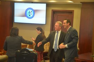 It was not the most amicable battle of attorneys during four days of trial, but after the jury went in to deliberate, Assistant State Attorneys Charlene Sullivan, left, and Jason Lewis, right, shook hands with Kevin Kulik, the defense attorney. His partner, Ashley Kay, is in the background. Click on the image for larger view. (© FlaglerLive)
