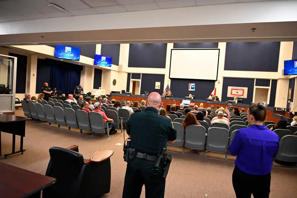 The audience at an August 2021 Flagler County School Board meeting had to be cleared from the room because it got unruly, before it was allowed back in. (© FlaglerLive)