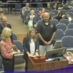 Anthony Zaksewicz, right, who has been teaching in Flagler County schools for 17 years, when he was honored by the local school board for being the recipient of a state teaching award last year. (© FlaglerLive via Flagler Schools TV)