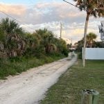 The back alley from South 17th to South 18th Street, behind the planned vacation rental building on a lot facing the ocean in Flagler Beach. Concerns about traffic on the back alley and other issues have caused repeated delays for the plans. (© FlaglerLive)