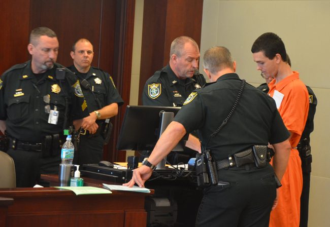 Bailiffs at the center of an inquiry the sheriff has ordered reopened, seen here during court proceedings last year, include Sgt. John Bray, left, Jeffrey Puritis and John Freshcorn. Bray was the bailiffs' supervisor. (c FlaglerLive)