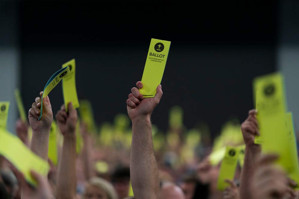Attendees, or ‘messengers,’ hold up their ballots during the Southern Baptist Convention’s annual meeting in 2022. (AP Photo/Jae C. Hong)