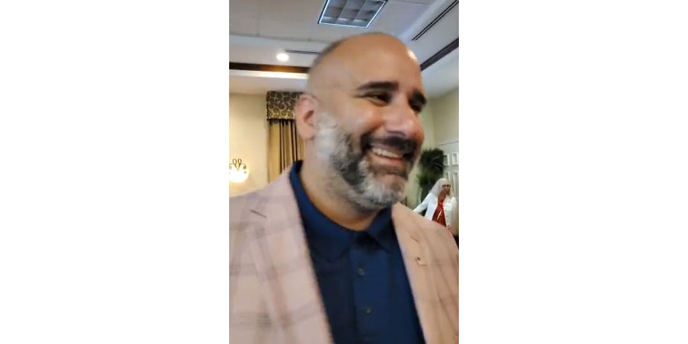 Victor Barbosa at Alan Lowe's election-night party at the Hilton Garden Inn, in a still from a video posted on Facebook.