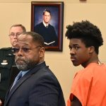 Damari Barnes, right, with his attorney, Steven Robinson, in court Monday. (© FlaglerLive)