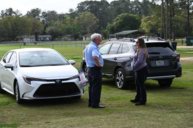 Supervisor of Elections Kaiti Lenhart, checking on a polling station during Bunnell's March election, spoke briefly with Robert Barnes at the time. (© FlaglerLive)