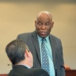 Defense attorney Junior Barrett speaking with Assistant State Attorney Jason Lewis during a break in jury selection. “I'm from the islands. We tend to speak fast in the islands. I don't know. (© FlaglerLive)