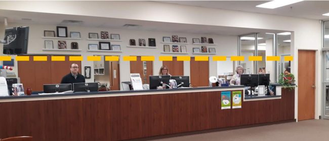 What Supervisor of Elections Kaiti Lenhart calls "a half-wall glass barrier" would rise about 4 feet above front-desk staffers' counter space. (Supervisor of Elections)