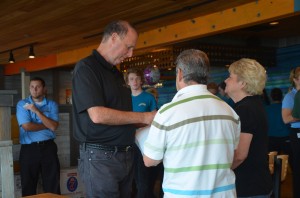 Ray Barshay spoke with George Hanns, the county commissioner, who was one of his first guests at the Funky Pelican Wednesday. Barshay had not met Hanns before. (c FlaglerLive)