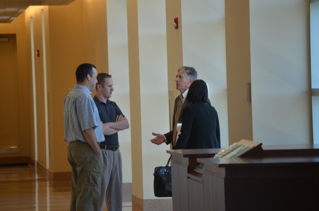 Dennis Bayer, right, with Wood and Bissonnette after a court appearance in mid-August. Click on the image for larger view. (© FlaglerLive)