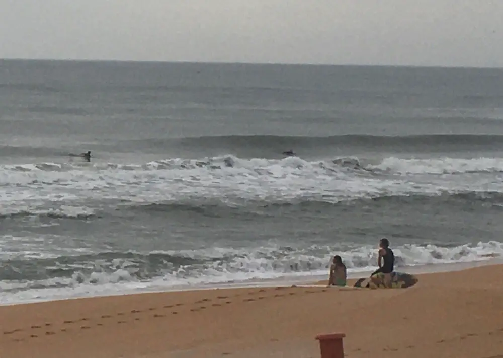 Beach-goers defying the orders to stay off the beach this morning just north of the Flagler Beach city limit. (© FlaglerLive)