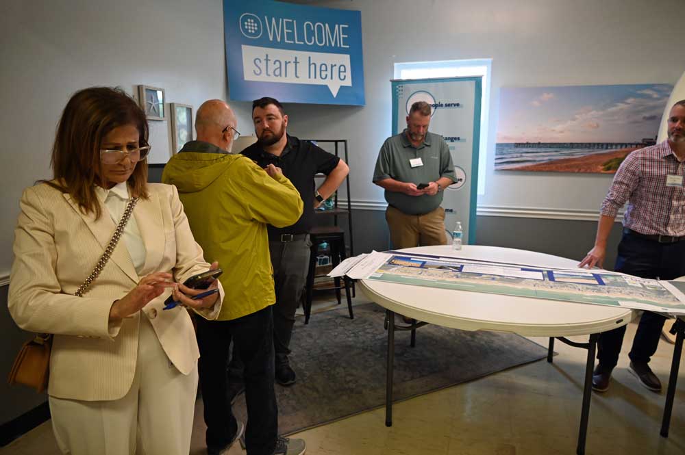 Much of the responsibility for the protection of Flagler County's beaches and State Road A1A will fall back on the county and the U.S. Army Coros of Engineers. County Engineer Faith al-Khatib, left, and the Army Corps' Jason Harrah, third from left, were at a public meeting Tuesday evening where the state Department of Transportation presented its latest plans for A1A protection. (© FlaglerLive)