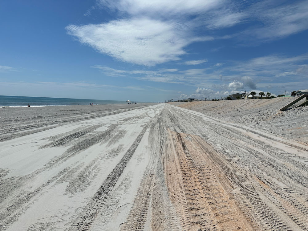 The beach south of the Flagler Beach pier shortly after it was renourished in July 2024. Flagler County is hoping to extend similar, if less extensive, renourishment efforts across all 18 miles of county beaches. (© FlaglerLive)