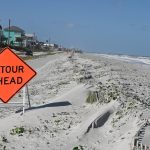 Shortly after the U.S. Army Corps of Engineers completed the renourishment of 3 miles of beach in Flagler Beach last summer, a storm blew a thick coating of sand onto State Road A1A. (© FlaglerLive)