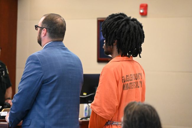 Lumpkins with his attorney, Spencer O'Neal, before the judge. (© FlaglerLive)
