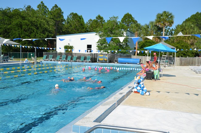 The Synchro Belles practice at Belle Terre Swim and Racquet Club six times a week, but the cold temperature of the pool has been a problem. (© FlaglerLive)