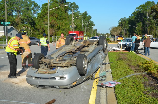 The Mustang was southbound when it was struck by the Hyundai, flipping and taking a road sign down. Click on the image for larger view. (© FlaglerLive)