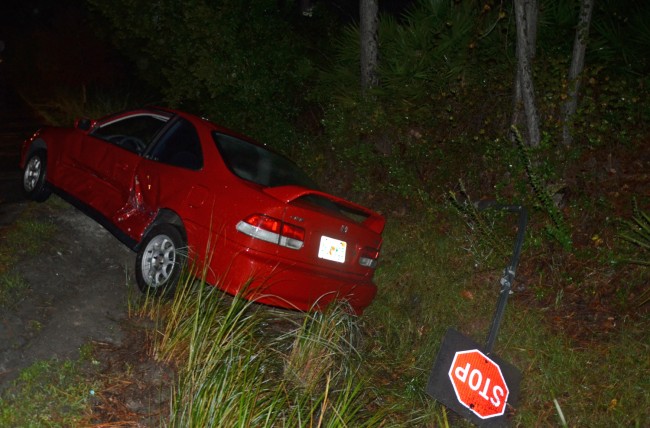 The Honda was forced into the ditch at the intersection of Belle Terre Parkway and Ponce de Leon Boulevard. (c FlaglerLive)