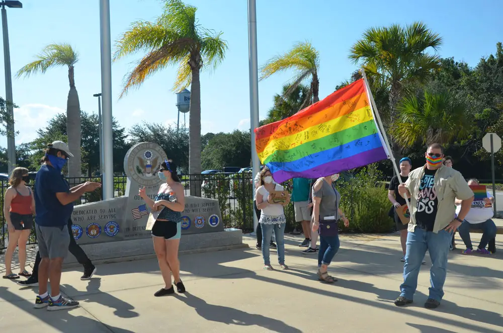 A small demonstration supporting transgender rights at the Government Services Building last June, led by Randall Bertrand, who is now running for a Flagler County School Board seat. (© FlaglerLive)