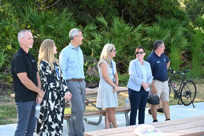 City Manager Denise Bevan, second from right, with some of her top staff. Andy Dance, the county commissioner, right, perhaps only wishes he were a member of that government. (© FlaglerLive)