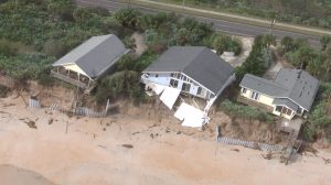 A half dozen homes along the shore just south of Varn Park on State Road A1A are feared lost as erosion continues to undermine their foundations. Click on the image for larger view. (Flagler County)