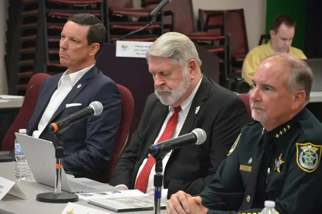 The clenched jaw was not an illusion: Clerk of Court Tom Bexley, left, was angry, and he let the county commission know it Thursday afternoon as he sat alongside Interim Manager Jerry Cameron and Sheriff Rick Staly. (c FlaglerLive)