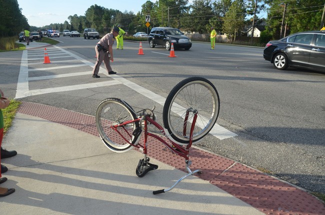 Florida Highway Patrol investigators at the scene of a bicycle-and-vehicle crash on Belle Terre Parkway in 2012. (© FlaglerLive)