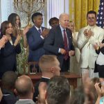 President Biden today immediately after signing the executive order extending protections to LGBTQ+ individuals, with Flagler Palm Coast High School's Jack Petocz at right. (White House Facebook video)