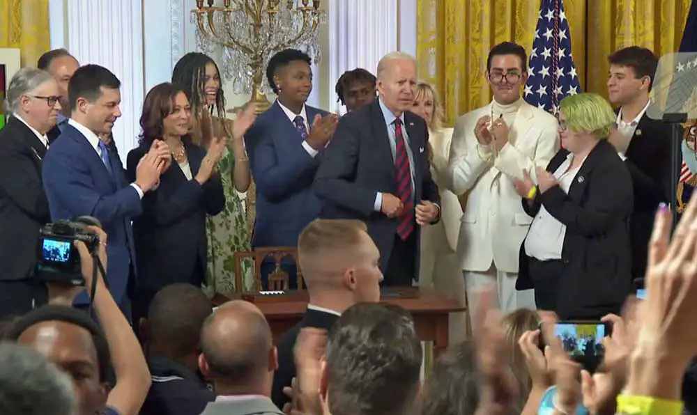 President Biden today immediately after signing the executive order extending protections to LGBTQ+ individuals, with Flagler Palm Coast High School's Jack Petocz at right. (White House Facebook video)