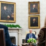 President Joe Biden meeting with staff in June. (White House)
