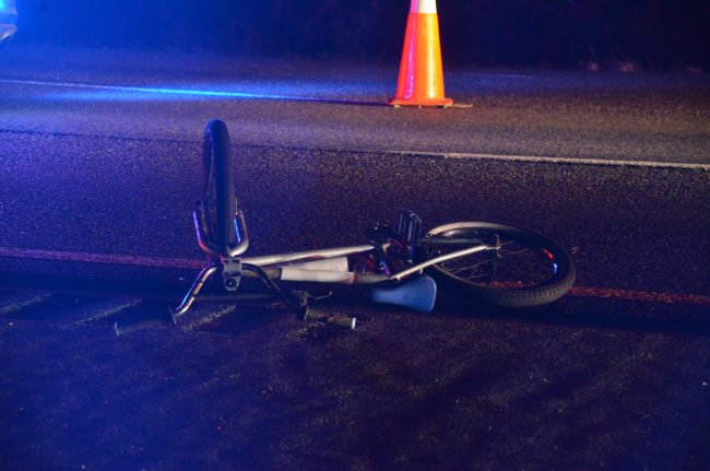 A bicycle at the crash scene, a few dozen feet north of the vehicle. The bicycle was reportedly in or on top of the vehicle. (© FlaglerLive)