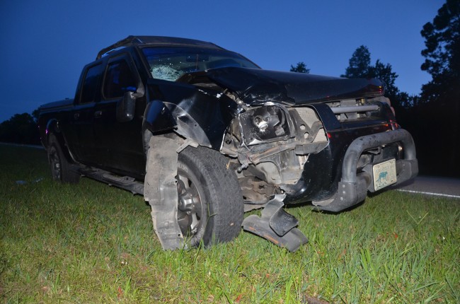 The passengenr-side front of the Nissan SUV was demolished by the violence of the impact with the cyclist. Click on the image for larger view. (© FlaglerLive)