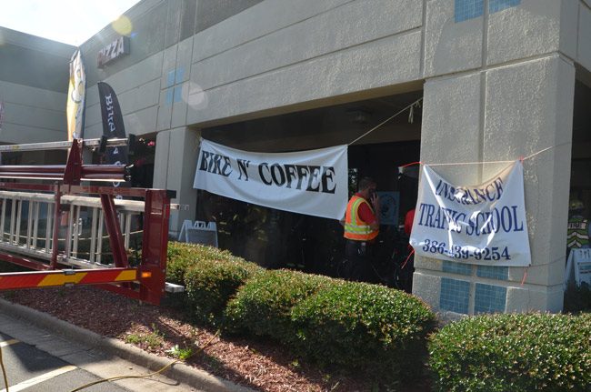 Friday morning's fire broke out at the Flagler Plaza Bike N Coffee shop. (© FlaglerLive)