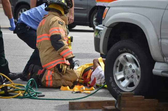 Calvin Pinero as he was being treated by paramedics. Click on the image for larger view. (c FlaglerLive)
