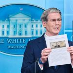 Treasury Secretary Scott Bessent holds up an image of the proposed $250 bill in May 2026.