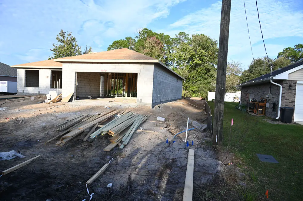 The house under construction at 98 Birchwood Drive and the concerns by neighboring residents about its elevation, which they say may cause flooding on their yards, has brought intense attention to an issue numerous Palm Coast residents have reported across the city as new homes have gone up. (© FlaglerLive)