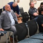 Greg Blose, left, at a public meeting last year during his tenure as the Chamber of Commerce's CEO. Michael Chiumento, the attorney and current chair of the chamber, is in the front row at right.