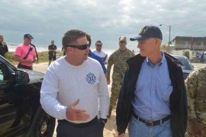 Flagler Beach Fire Chief Bobby Pace with the governor. Click on the image for larger view. (c FlaglerLive)