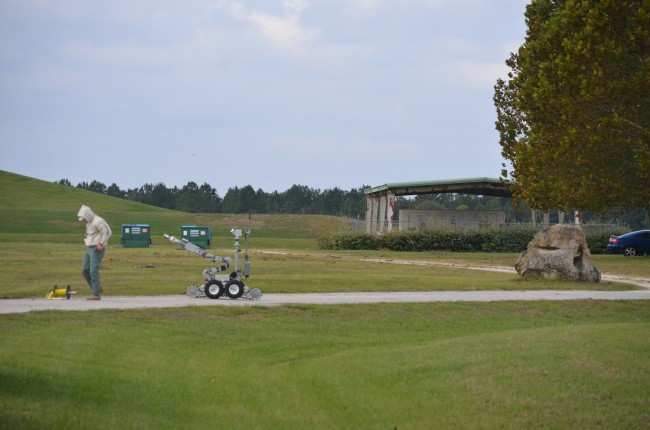 The grenades were discovered by landfill workers under the overhang to the right. Click on the image for larger view. (© FlaglerLive)