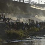 Hundreds of asylum-seekers gather on the banks of the Rio Grande to enter the U.S. on Dec. 12, 2022. (Jose Zamora/Anadolu Agency via Getty Images)