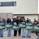 FPC Principal Bobby Bossardet, center, with some of the students who turned up for the 6th annual Bulldog Block Party at the Carver Center last week. (Flagler Schools)