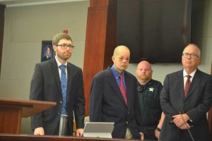 Joseph Bova, second from left, with his attorneys, Josh Mosley, left, and Matt Phillips. (© FlaglerLive)