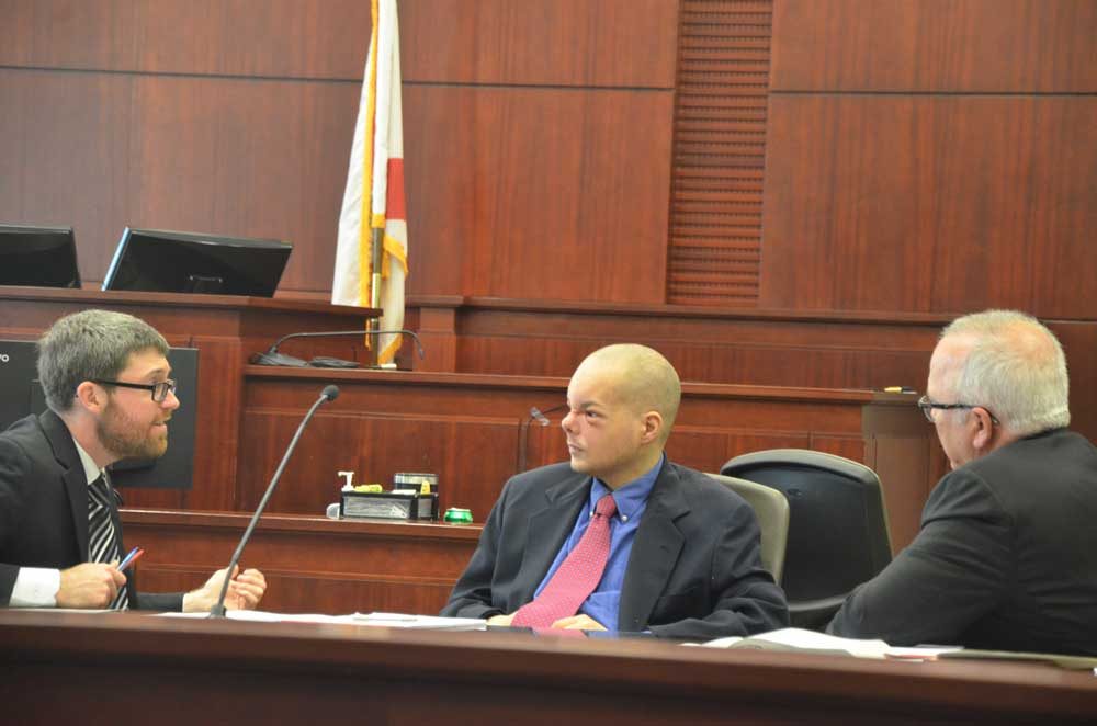 Joseph Bova, center, with his attorneys, Joshua Mosley, left, and Matt Phillips, just before jury selection this morning. (© FlaglerLive)