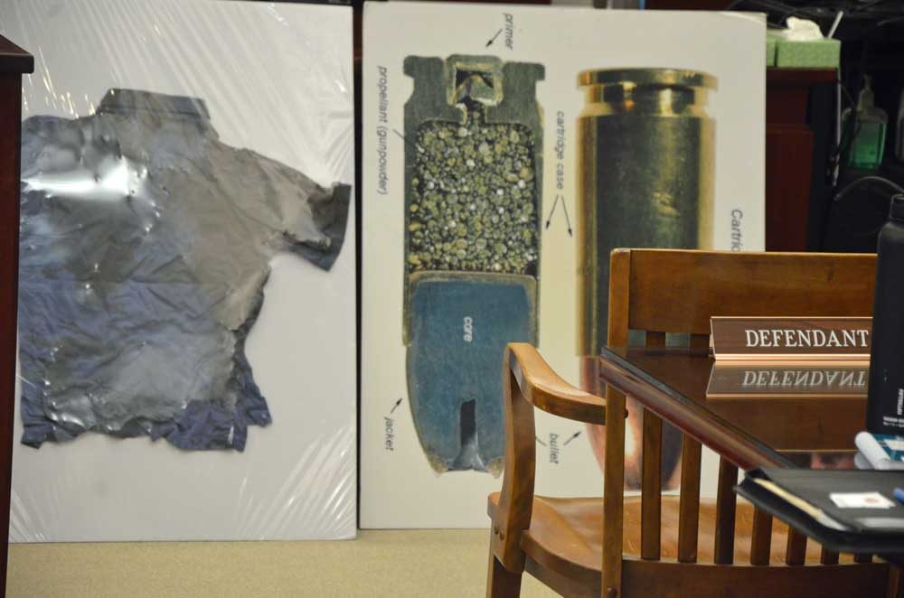 A display by the prosecution for the jury showing the sort of ammunition Joseph Bova fired at Zuheili Rosado when he murdered her in 2014, and the shirt Rosado was wearing at the time. The display was shown the jury on Wednesday as Bova's trial continues this week. See details below. (© FlaglerLive)