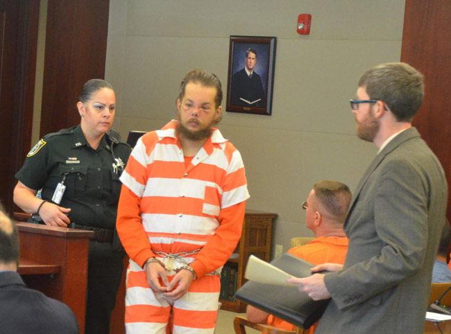 Joseph Bova, center, with his attorney, Joshua Mosley, right, in Bova's last court appearance in April. He has been at the Flagler County jail since, but his mental state is unclear. (© FlaglerLive)