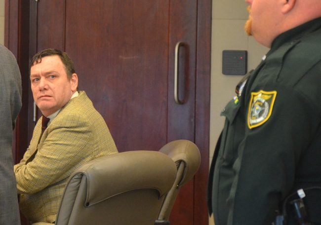 Michael Bowling, in court this afternoon, will not soon be freed of wardens despite today's mistrial. (c FlaglerLive)