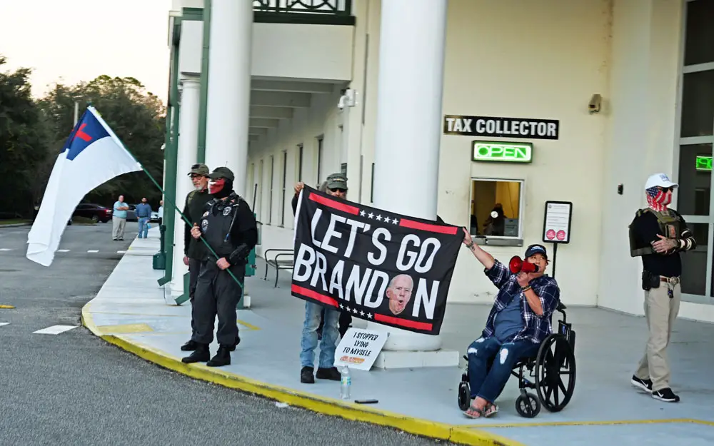 The epithet was brandished by individuals, many masked, most from out of town, who hurled obscenities at Flagler County students demonstrating against book bans at the Government Services Building earlier this month. (© FlaglerLive)